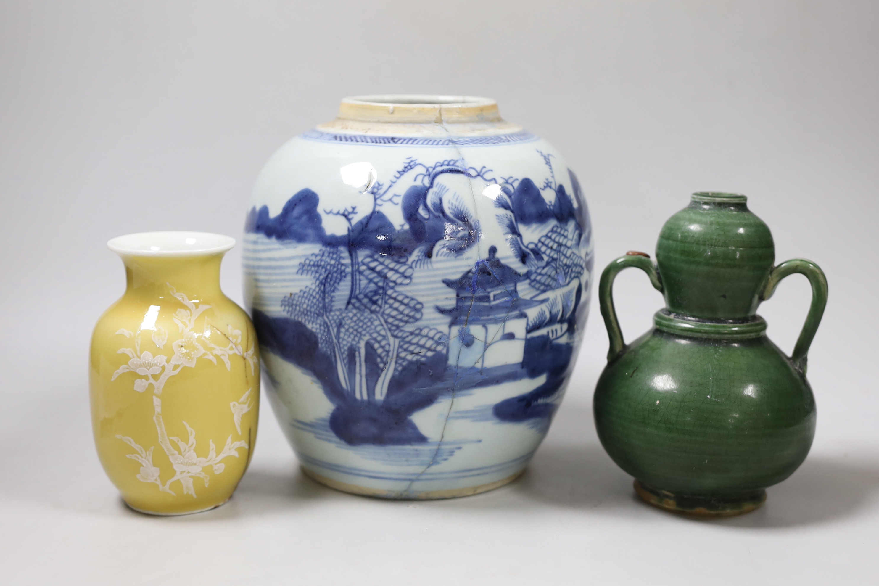 A Chinese blue and white vase, together with a Chinese green two handled double gourd vase and another, tallest 19cm